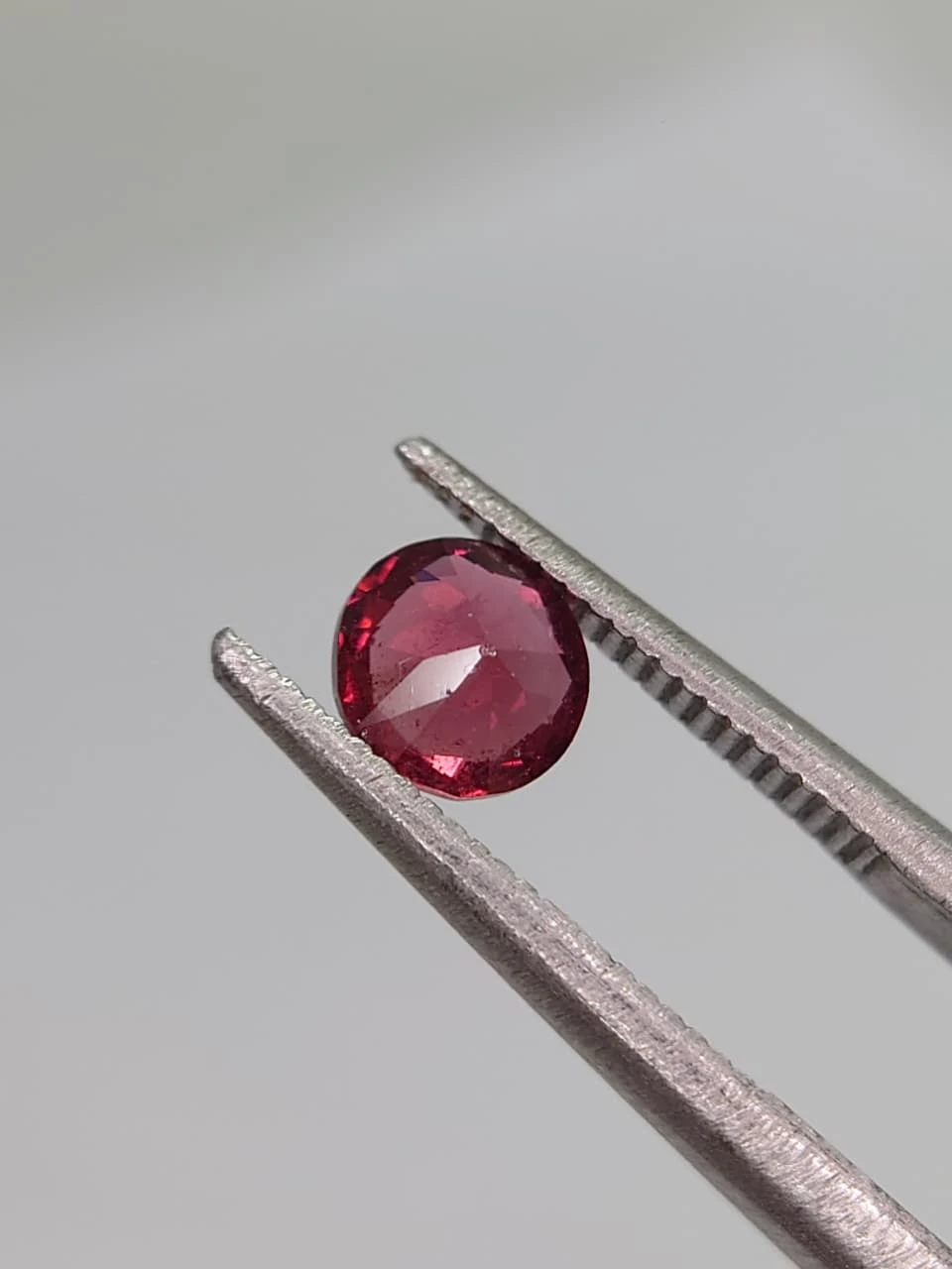0.6ct Natural Round Faceted Malaya Garnet from Tanzania — view 6